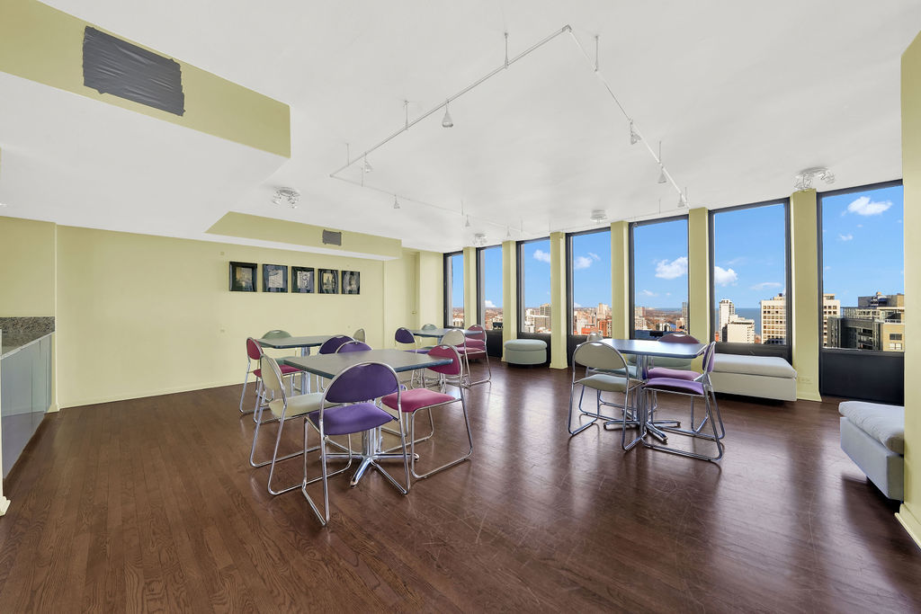100 East Walton Street, Unit 17C Chicago, IL 60611 - Photo 21 of 21 a living room with furniture and a wooden floor
