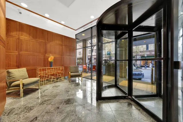 a view of a hallway with seating area