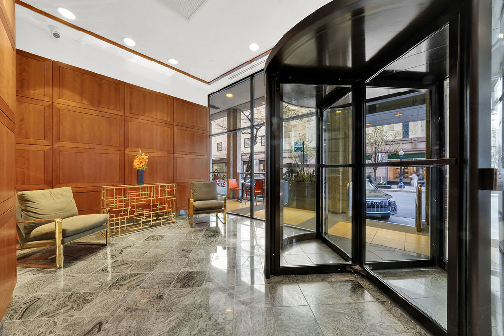 100 East Walton Street, Unit 17C Chicago, IL 60611 - Photo 5 of 21 a view of a hallway with seating area