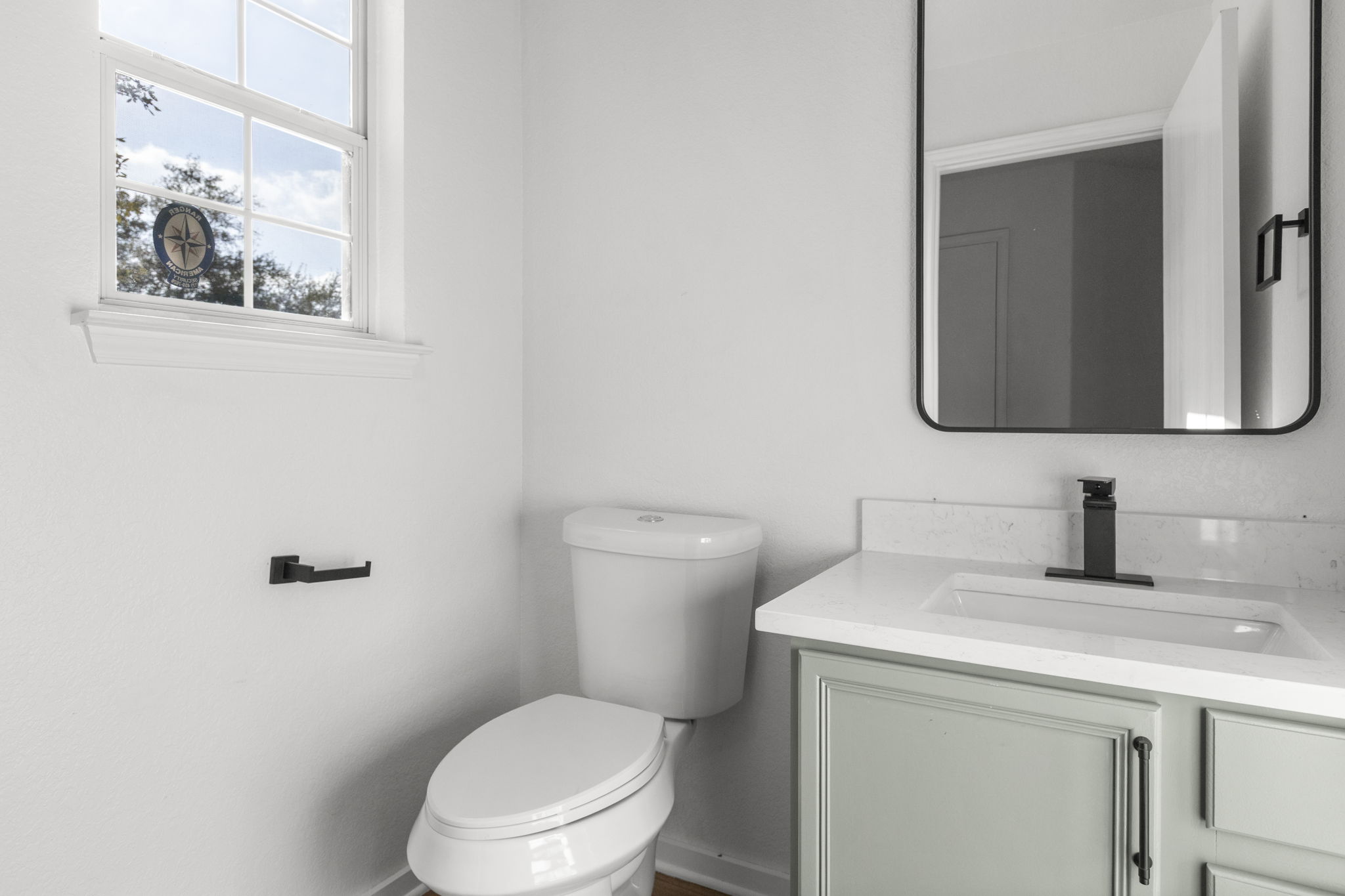 2110 Nogales Trail Austin, TX 78744 - Photo 31 of 37 a bathroom with a toilet sink and mirror