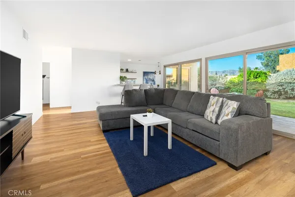 a backyard of a house with lots of green space and plants