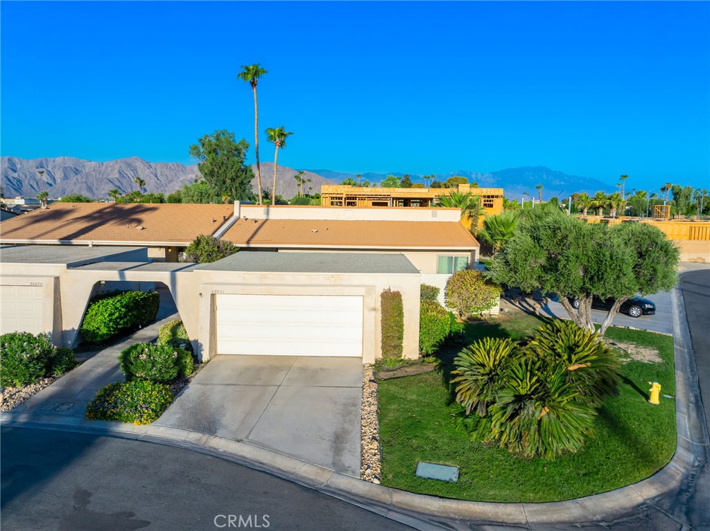 80071 Palm Cir Drive La Quinta, CA 92253 - Photo 2 of 40 a view of a house with a yard and potted plants