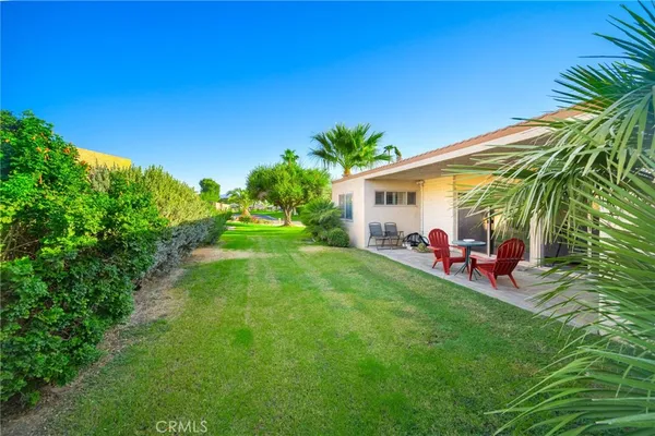 a kitchen with granite countertop cabinets stainless steel appliances and wooden floor