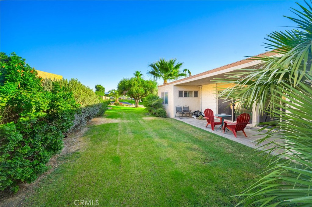 80071 Palm Cir Drive La Quinta, CA 92253 - Photo 21 of 40 a view of a backyard with plants and a patio
