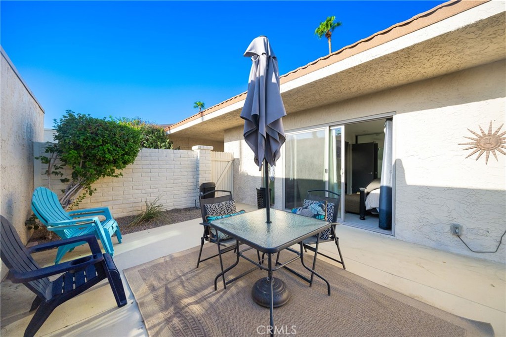 80071 Palm Cir Drive La Quinta, CA 92253 - Photo 33 of 40 a patio with a table and chairs