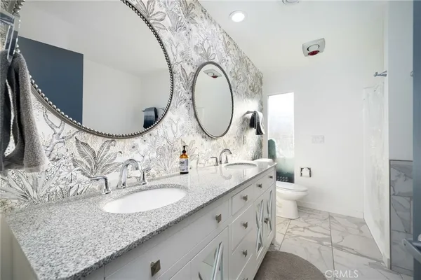 a bathroom with a sink and mirror