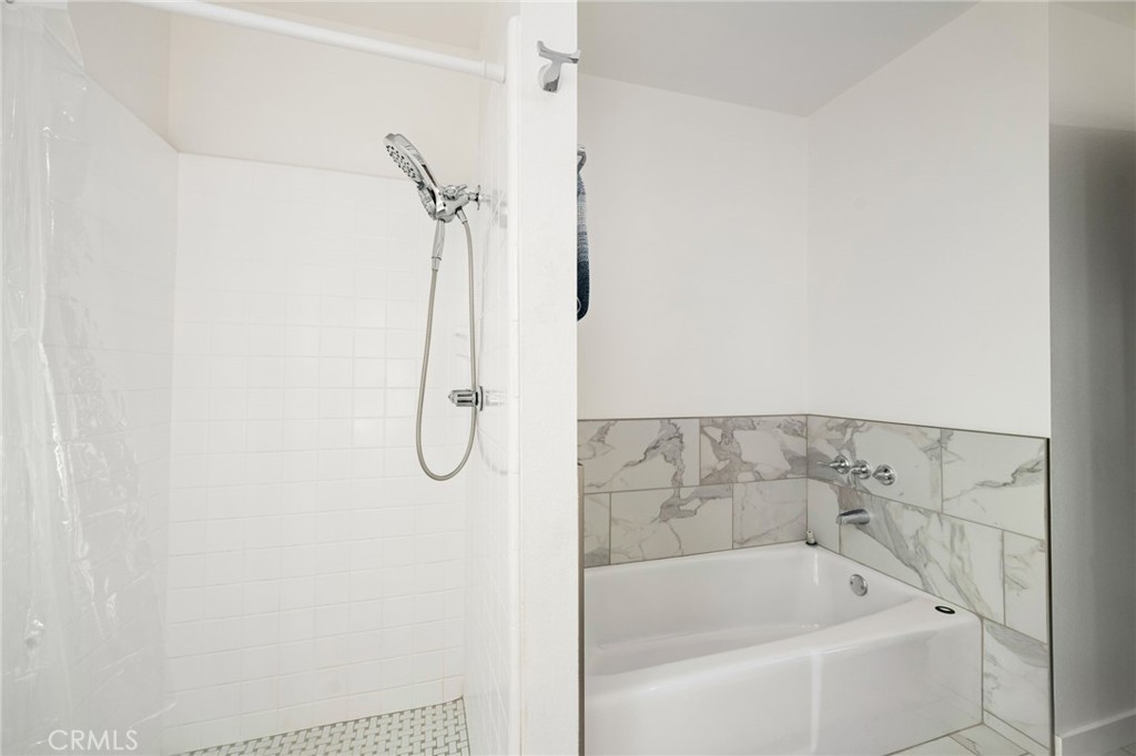 80071 Palm Cir Drive La Quinta, CA 92253 - Photo 36 of 40 a bathroom with a bath tub and shower