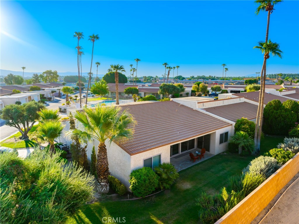 80071 Palm Cir Drive La Quinta, CA 92253 - Photo 6 of 40 a aerial view of a house with a garden and plants
