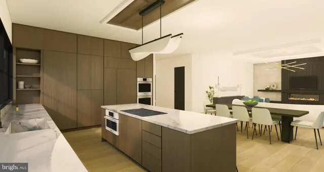 a kitchen with a sink a counter top space and stainless steel appliances