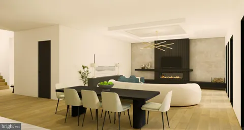 a view of a dining room with furniture and a rug
