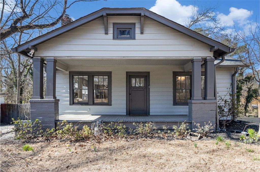 2265 Perkerson Road Southwest Atlanta, GA 30315 - Photo 1 of 1 a front view of a house with garden