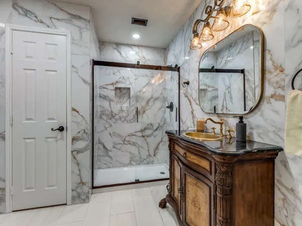 a view of bathroom with mirror gate