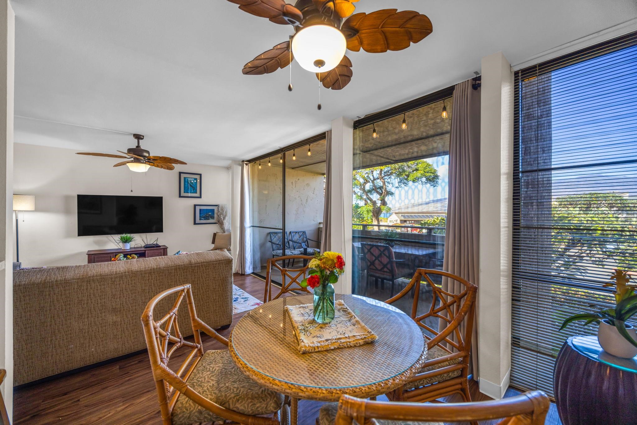 483 South Kihei Road, Unit 215 Kihei, HI 96753 - Photo 12 of 49 a view of a dining room with furniture window and wooden floor