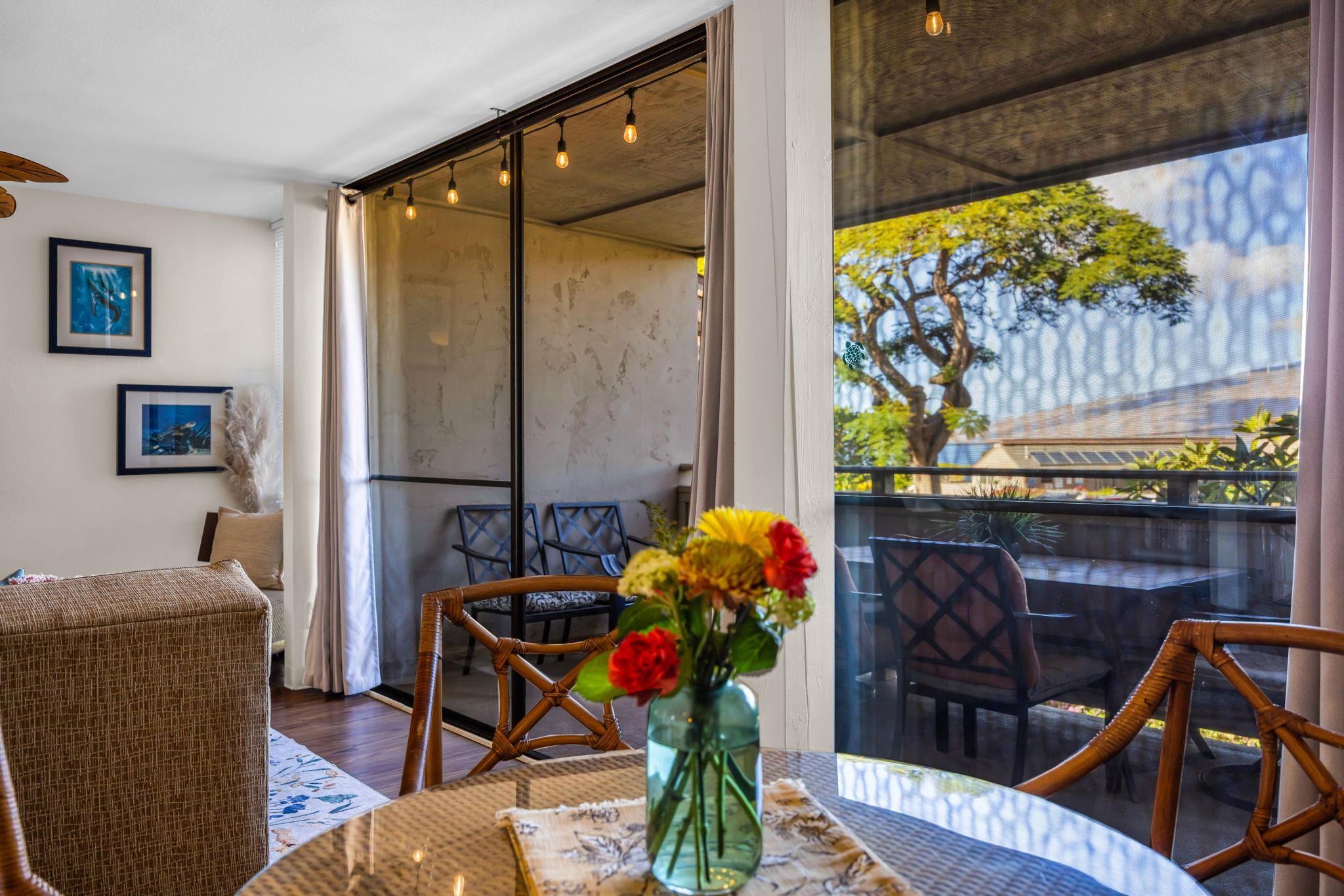 483 South Kihei Road, Unit 215 Kihei, HI 96753 - Photo 13 of 49 a living room with furniture and flowers