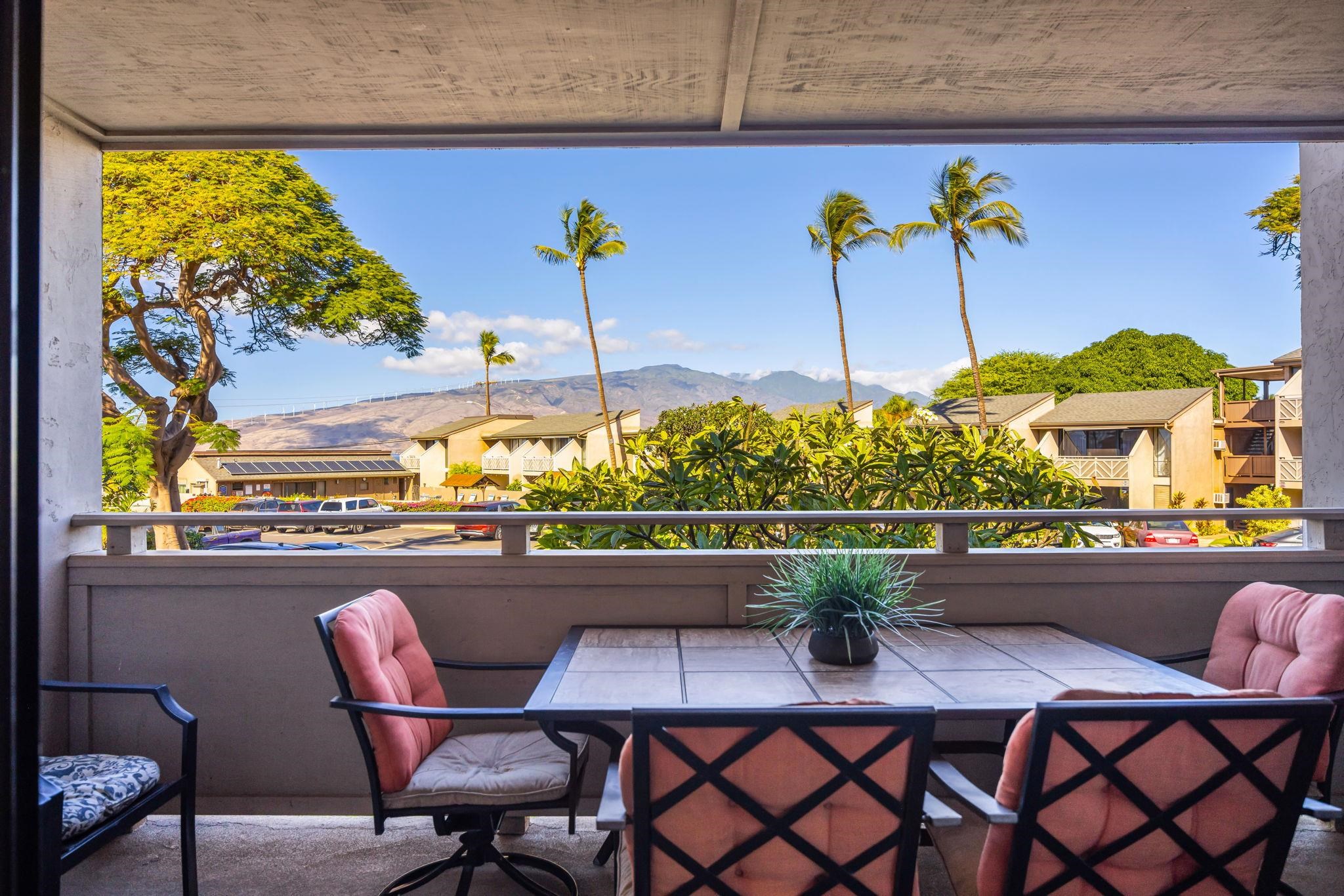 483 South Kihei Road, Unit 215 Kihei, HI 96753 - Photo 15 of 49 a view of a dining table and chairs in the patio