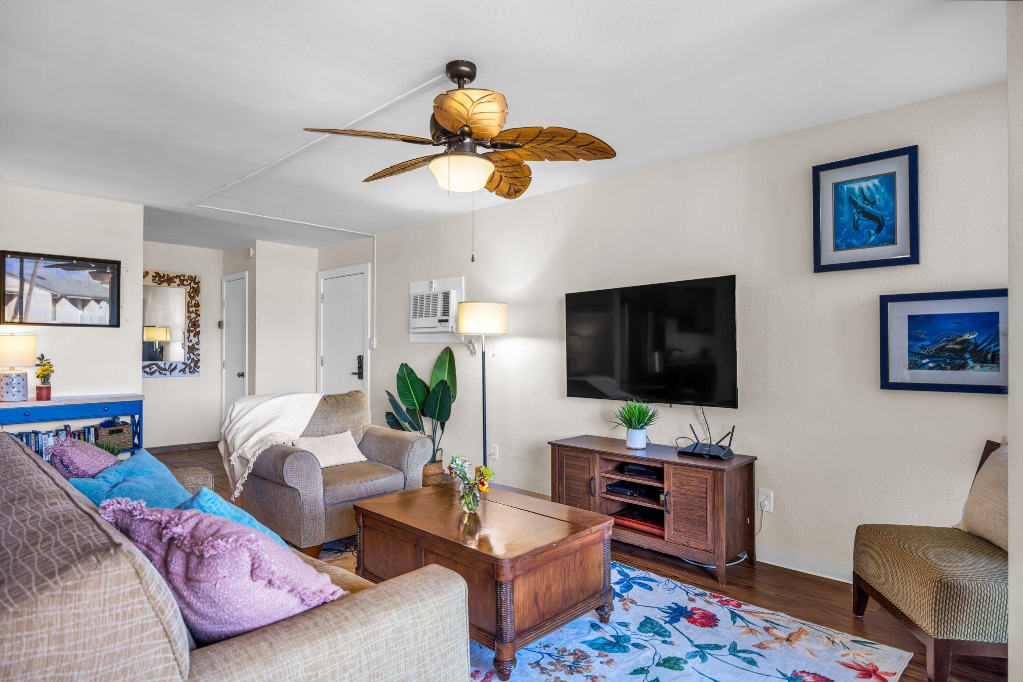 483 South Kihei Road, Unit 215 Kihei, HI 96753 - Photo 19 of 49 a living room with furniture and a flat screen tv