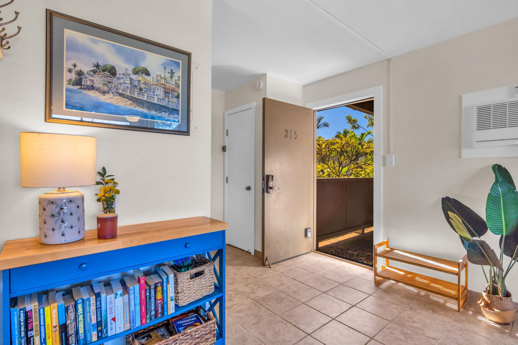 483 South Kihei Road, Unit 215 Kihei, HI 96753 - Photo 29 of 49 a bedroom with furniture and a book shelf