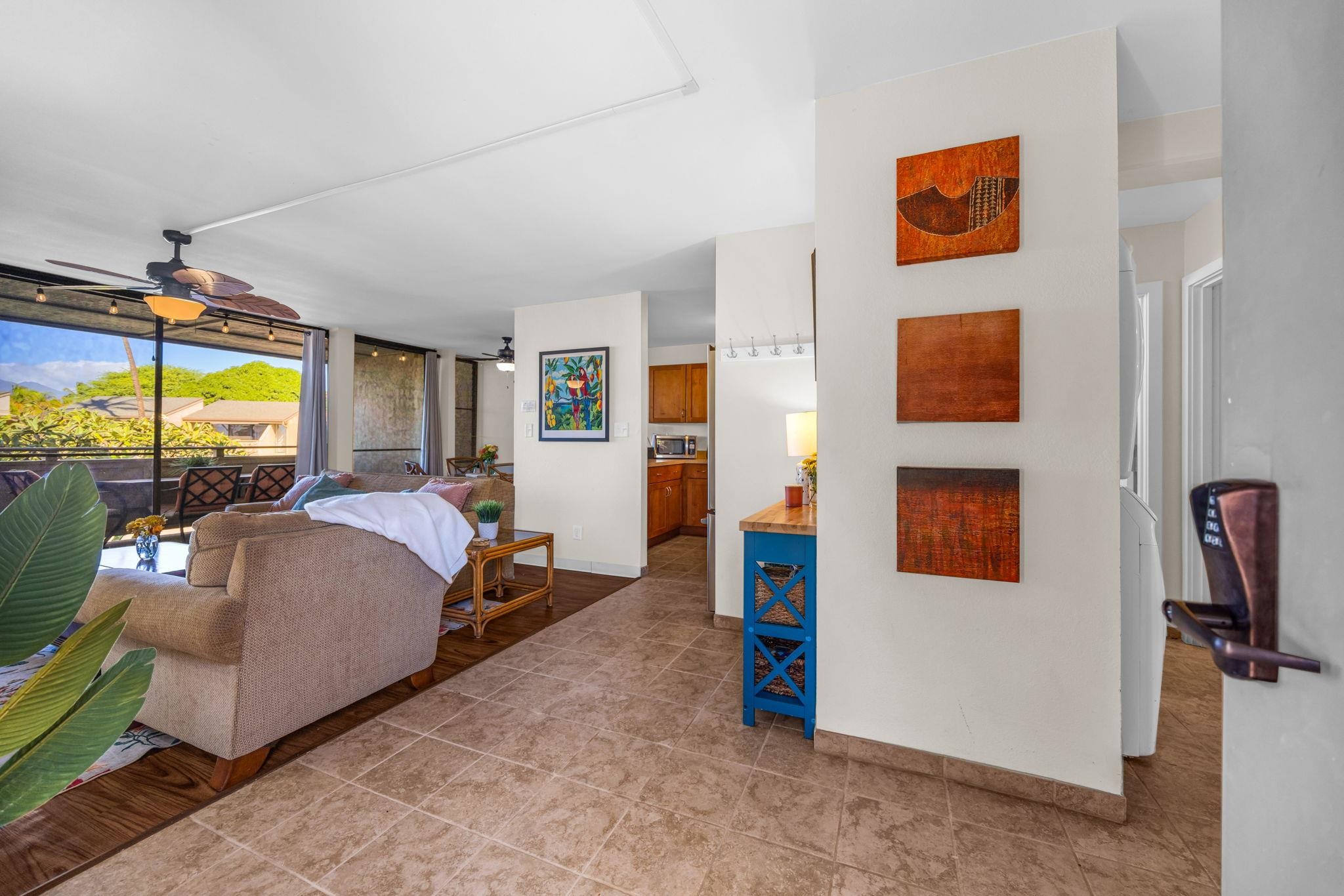 483 South Kihei Road, Unit 215 Kihei, HI 96753 - Photo 30 of 49 a bed room with a bed and a television