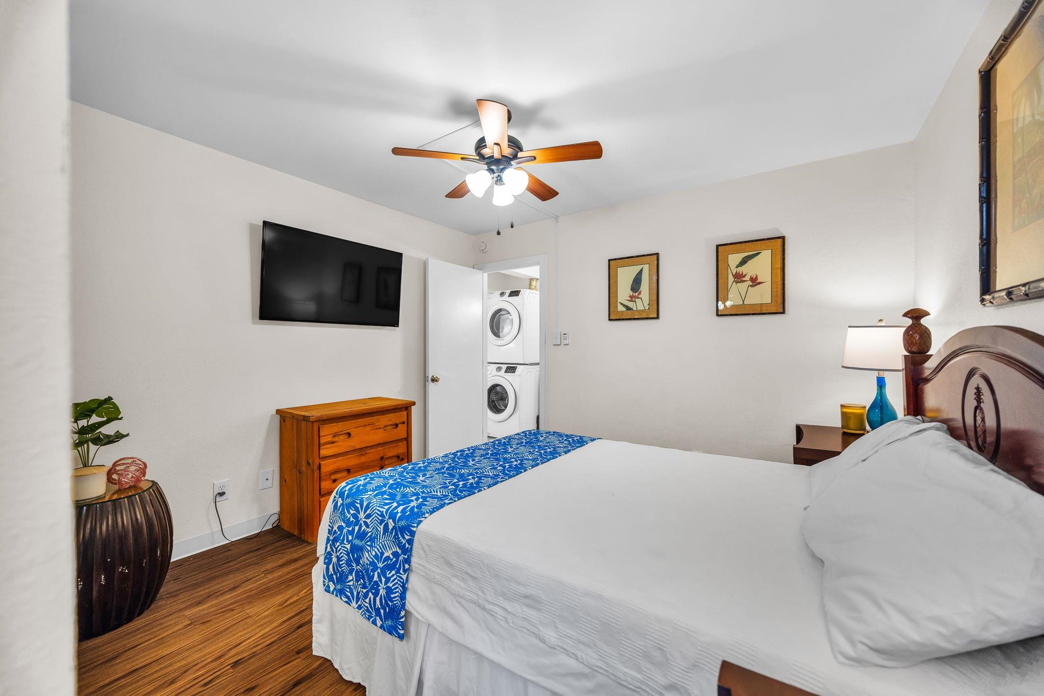 483 South Kihei Road, Unit 215 Kihei, HI 96753 - Photo 38 of 49 a bedroom with a bed and a television