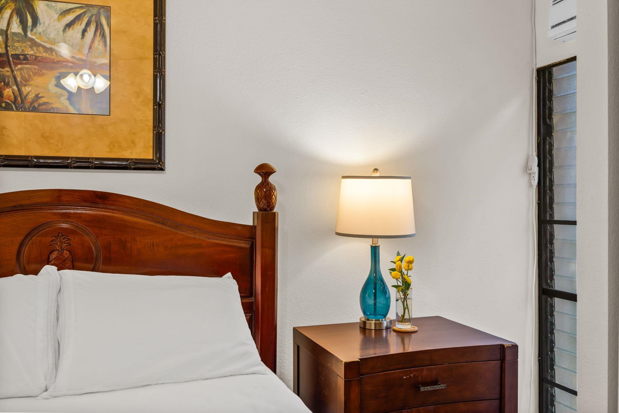 483 South Kihei Road, Unit 215 Kihei, HI 96753 - Photo 39 of 49 a bedroom with a bed and a table