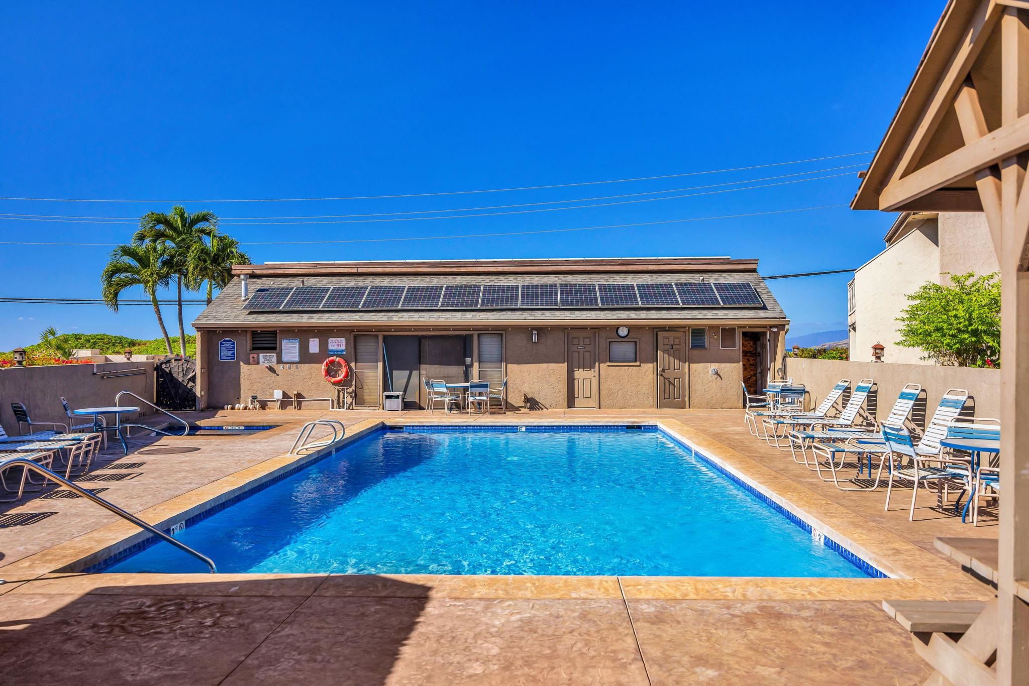 483 South Kihei Road, Unit 215 Kihei, HI 96753 - Photo 4 of 49 a view of a swimming pool with outdoor seating
