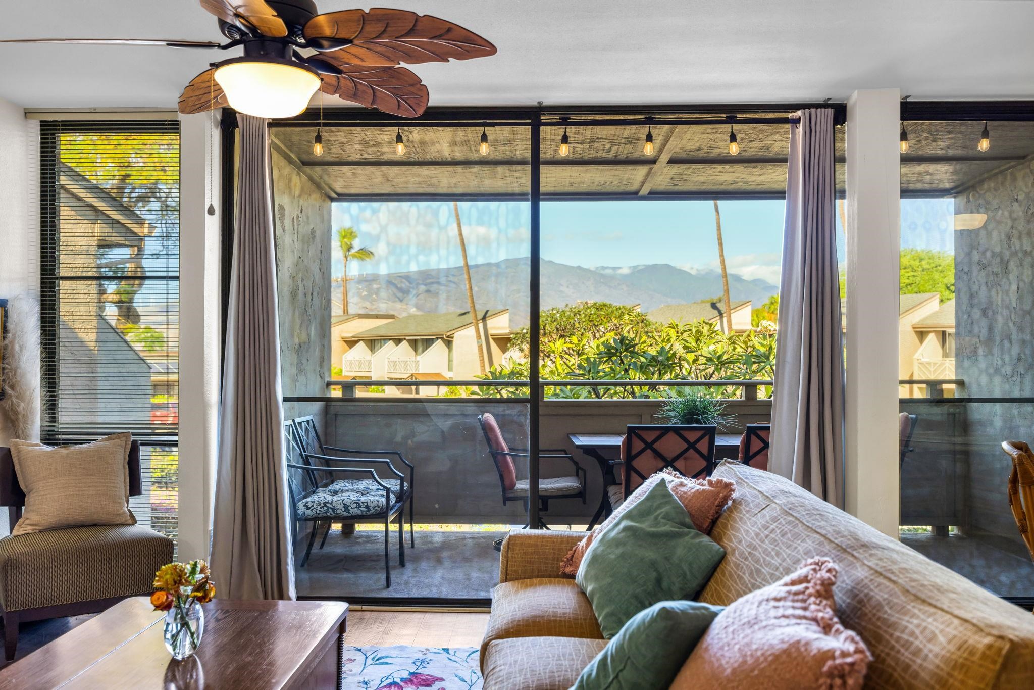 483 South Kihei Road, Unit 215 Kihei, HI 96753 - Photo 8 of 49 a living room with furniture and a large window