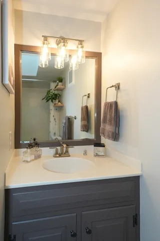 a view of an entryway with wooden floor and a livingroom