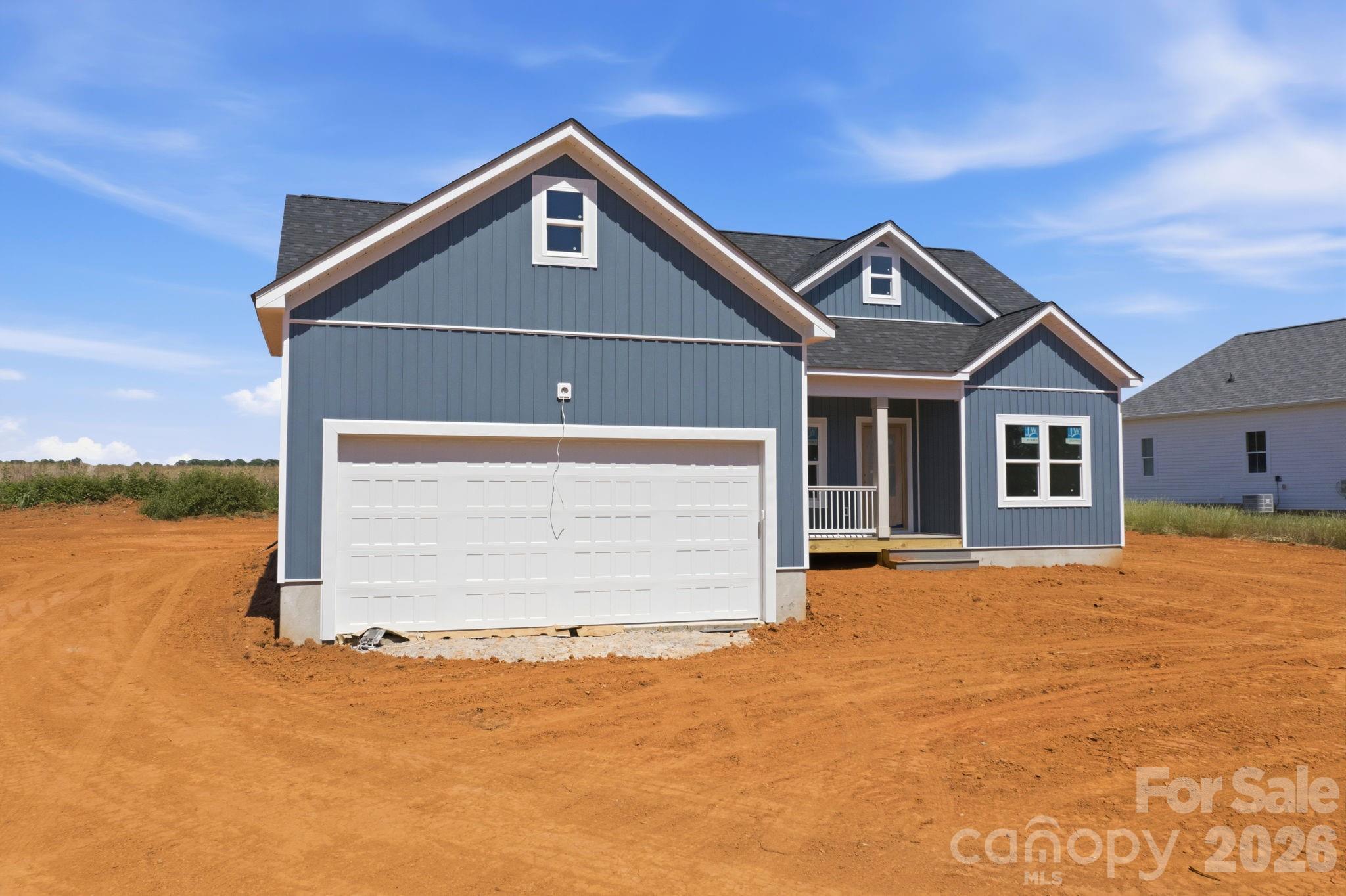 1720 Jennings Road Olin, NC 28660 - Photo 7 of 15 a front view of a house with a yard