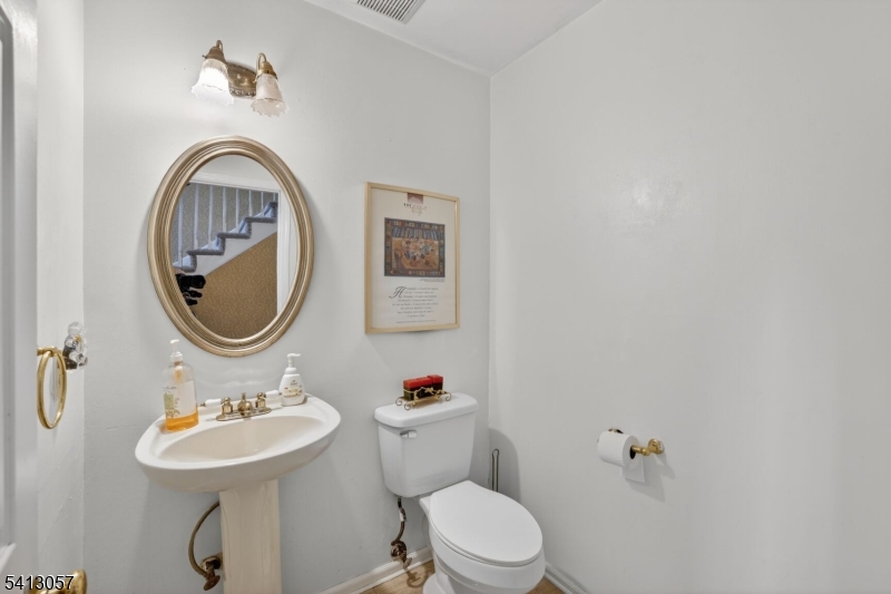 3 Turnburry Road Washington, NJ 07882 - Photo 12 of 24 a bathroom with a toilet a sink and a mirror