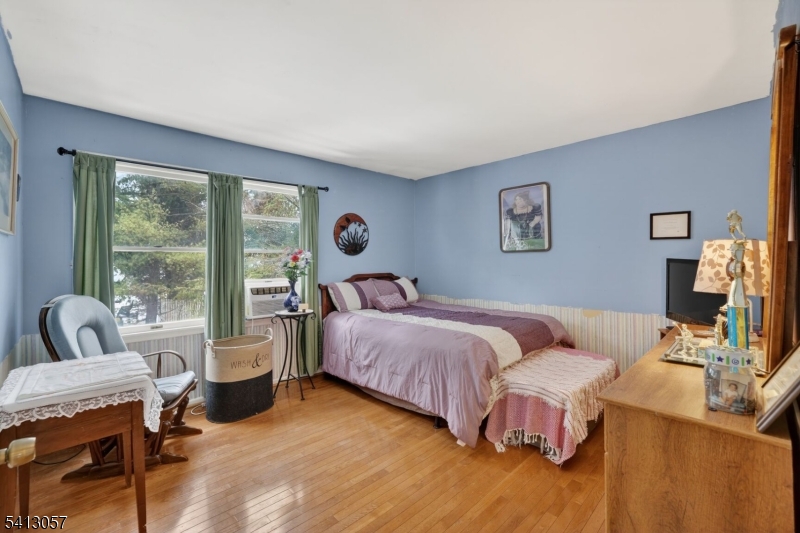 3 Turnburry Road Washington, NJ 07882 - Photo 15 of 24 a bedroom with a bed and wooden floor