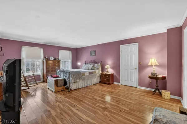 a bed room with a bed and a large window