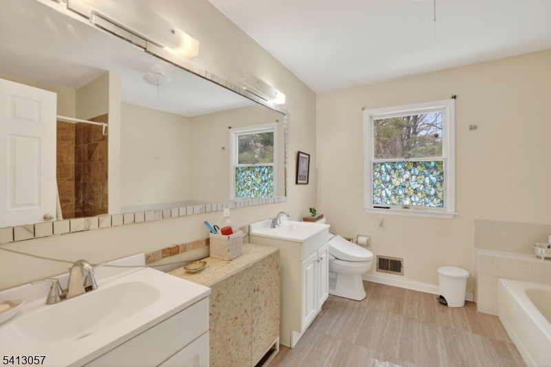 3 Turnburry Road Washington, NJ 07882 - Photo 18 of 24 a bathroom with a sink toilet and a mirror