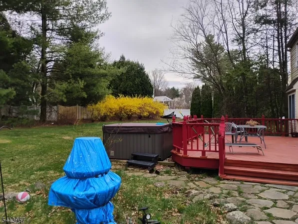 a view of a backyard with sitting area