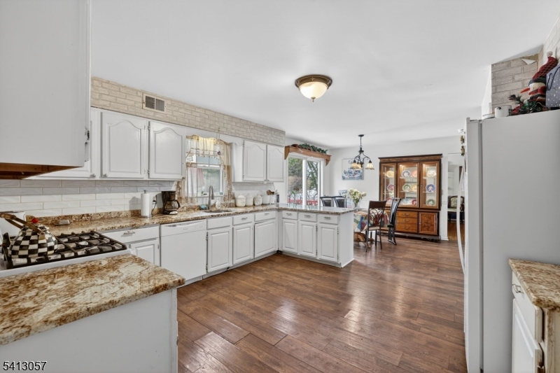 3 Turnburry Road Washington, NJ 07882 - Photo 8 of 24 a kitchen with a sink stove and cabinets
