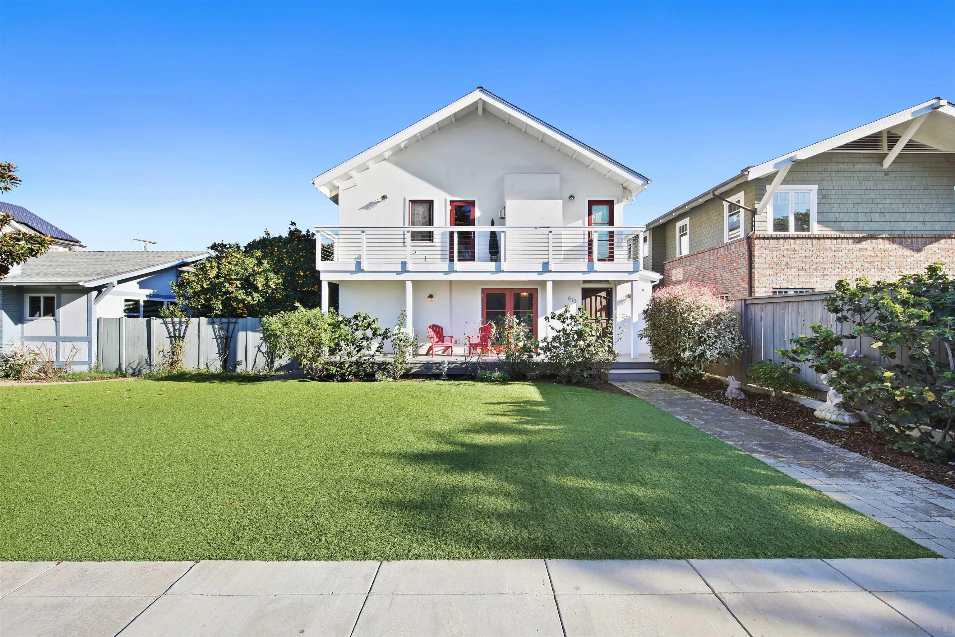 671 B Avenue Coronado, CA 92118 - Photo 1 of 41 a front view of a house with a garden