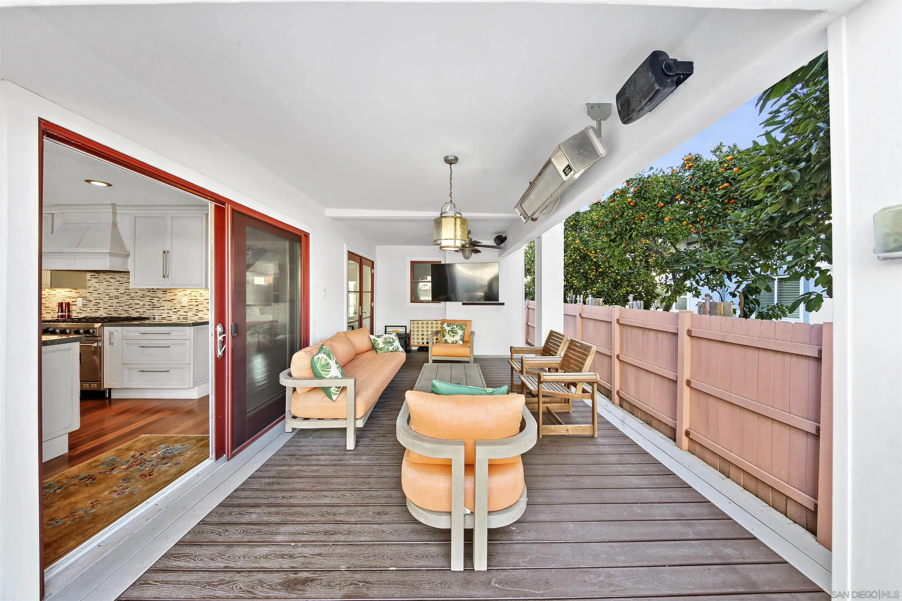 671 B Avenue Coronado, CA 92118 - Photo 11 of 41 a dining room with wooden floor and large windows
