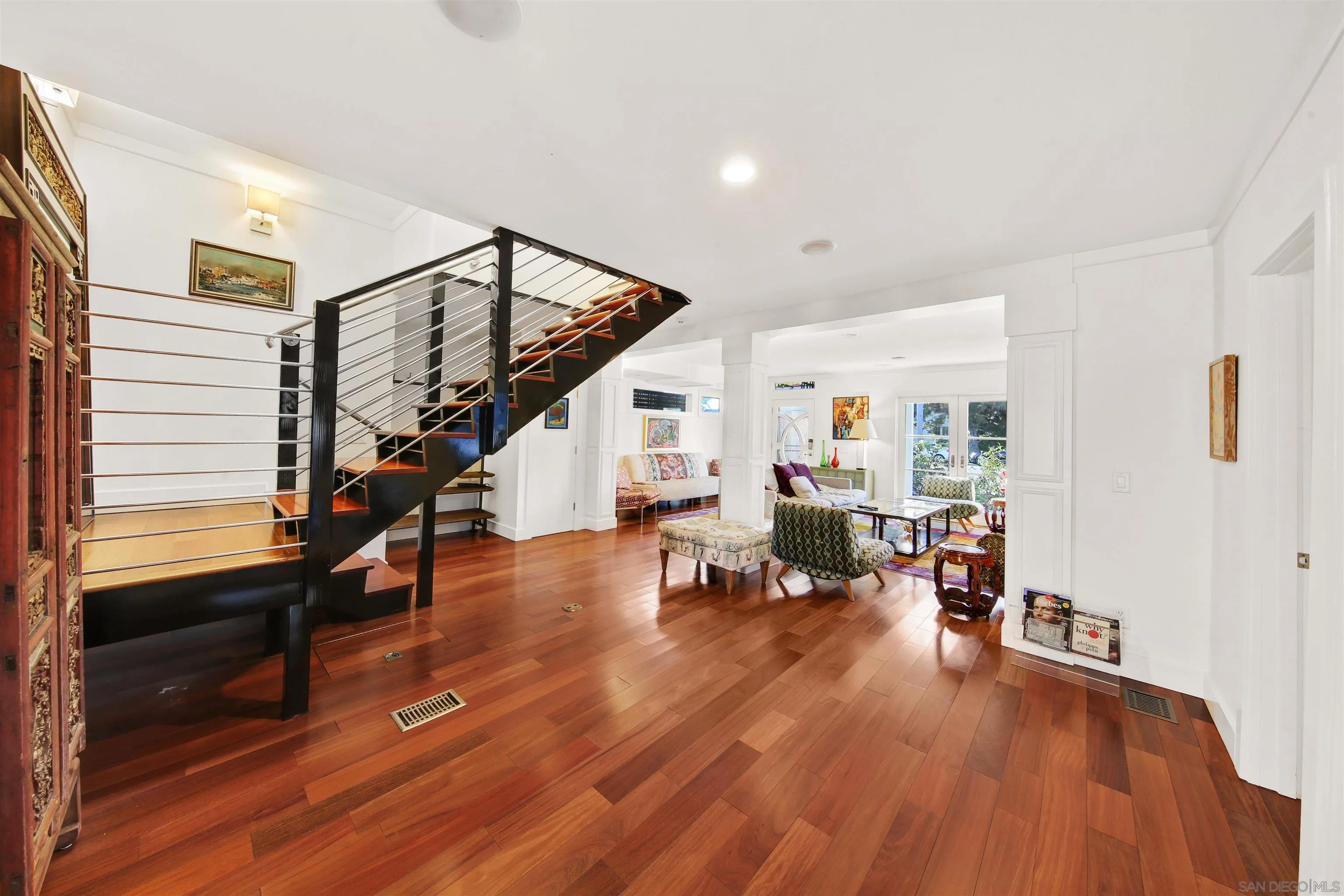 671 B Avenue Coronado, CA 92118 - Photo 15 of 41 a living room with furniture and a wooden floor