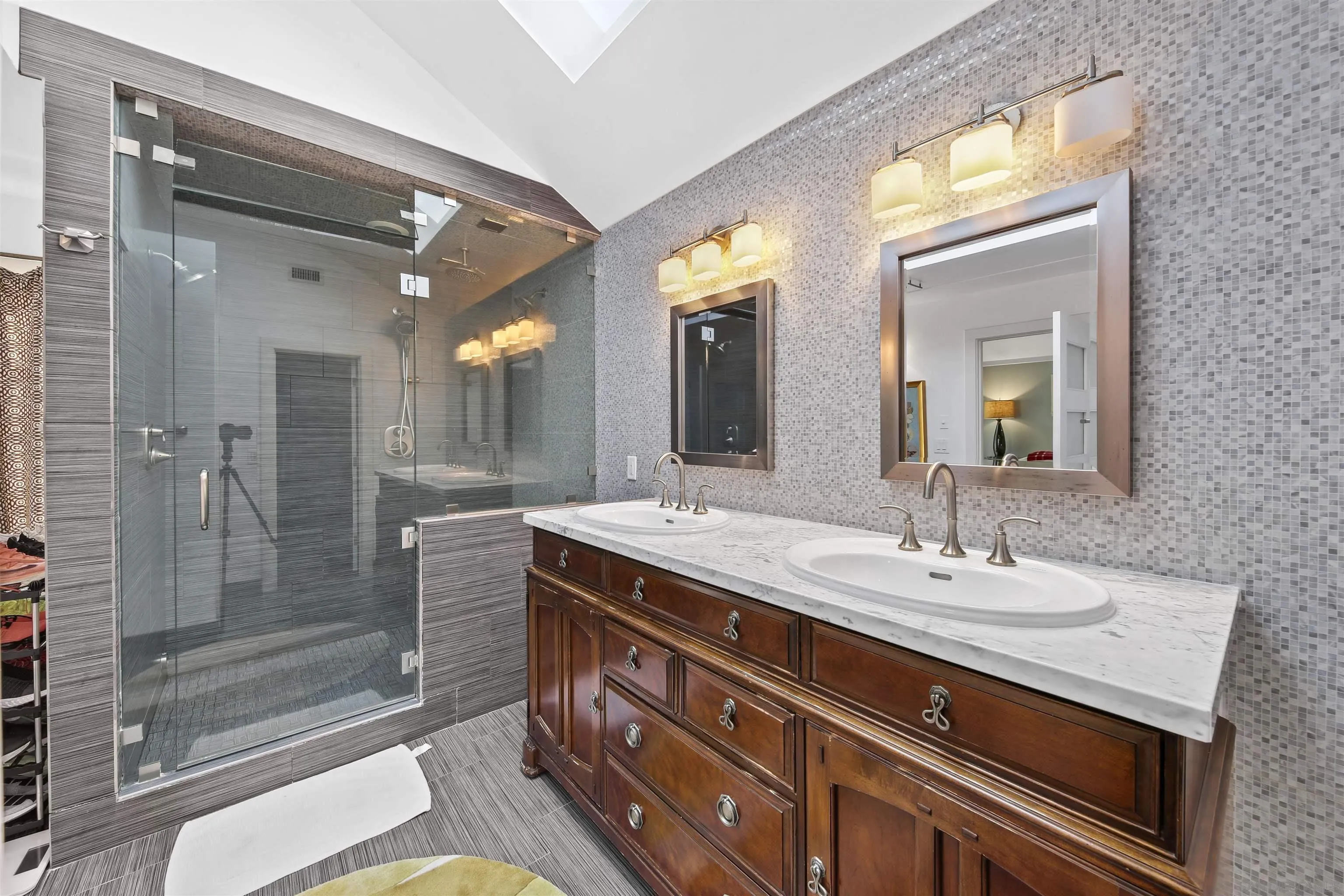 671 B Avenue Coronado, CA 92118 - Photo 17 of 41 a bathroom with a granite countertop sink mirror and shower