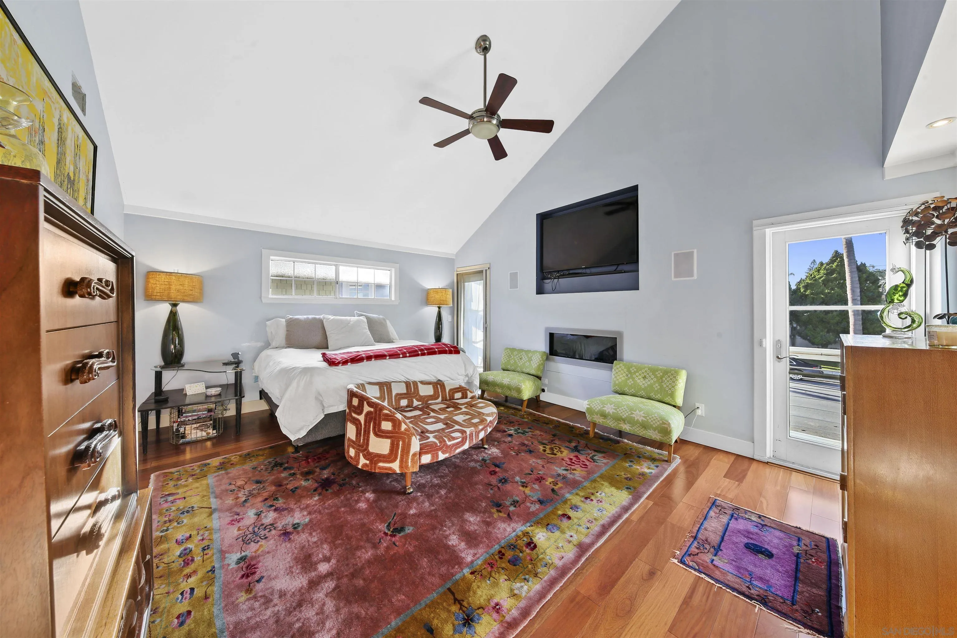 671 B Avenue Coronado, CA 92118 - Photo 19 of 41 a bed room with a bed a couch and a window