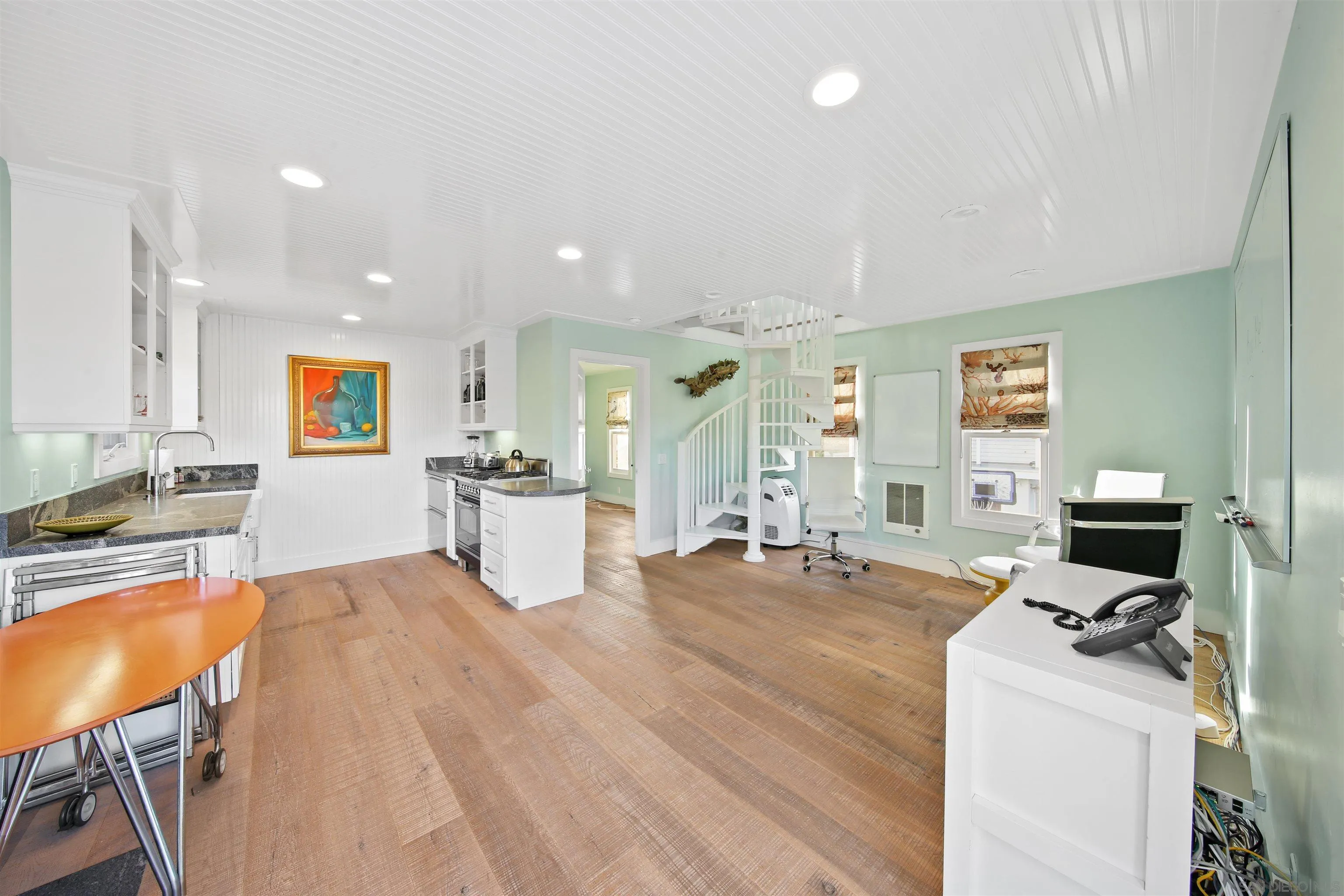 671 B Avenue Coronado, CA 92118 - Photo 29 of 41 a large white kitchen with a large window