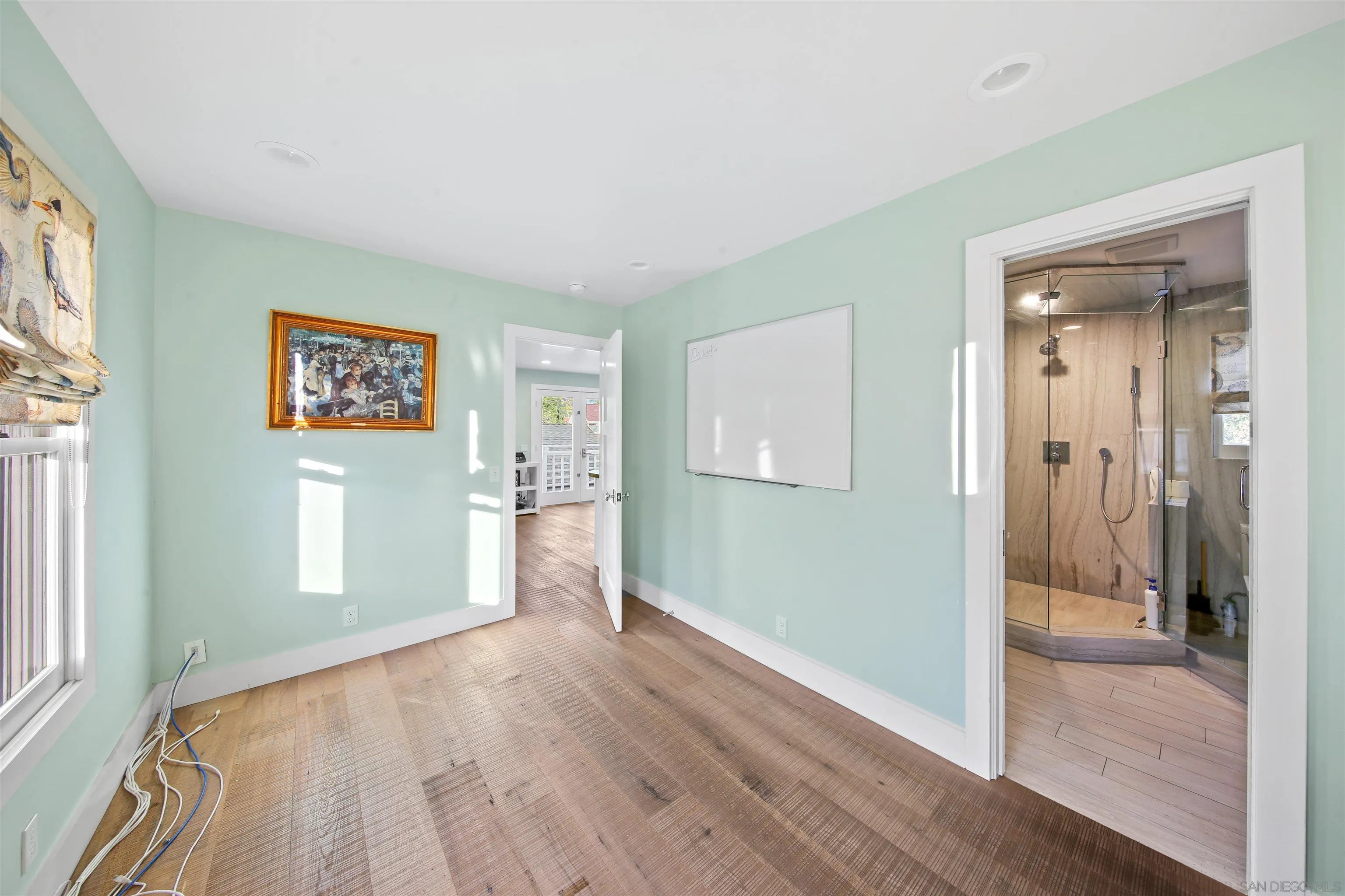 671 B Avenue Coronado, CA 92118 - Photo 32 of 41 a view of a room with wooden floor and windows