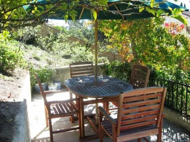 a view of a backyard with sitting area