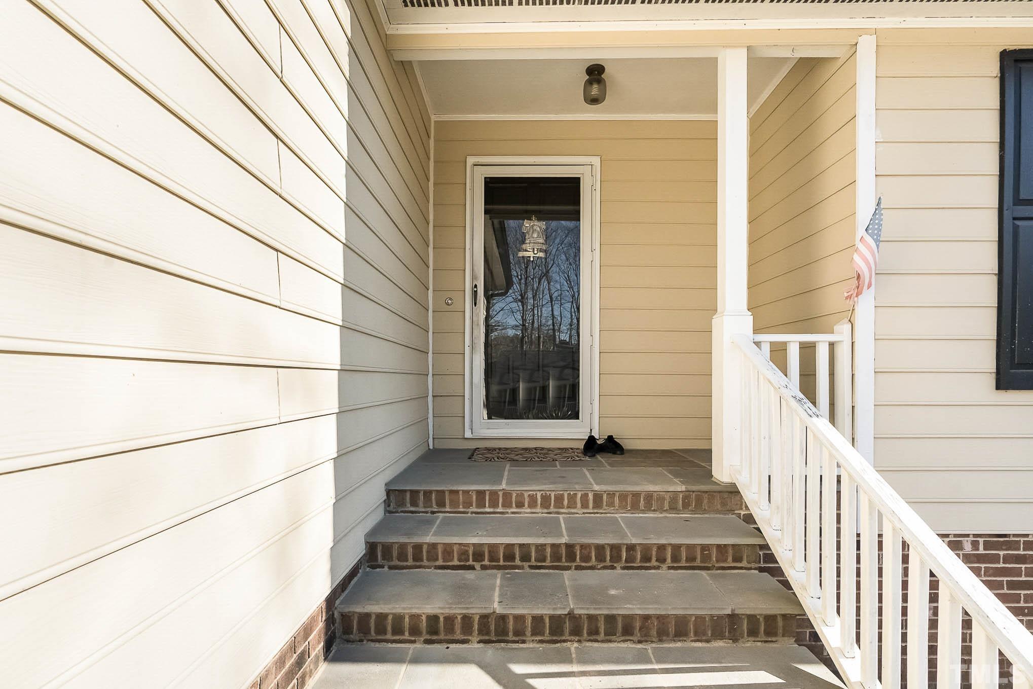 4100 Timberbrook Drive Raleigh, NC 27616 - Photo 3 of 24 a view of staircase with white walls and windows