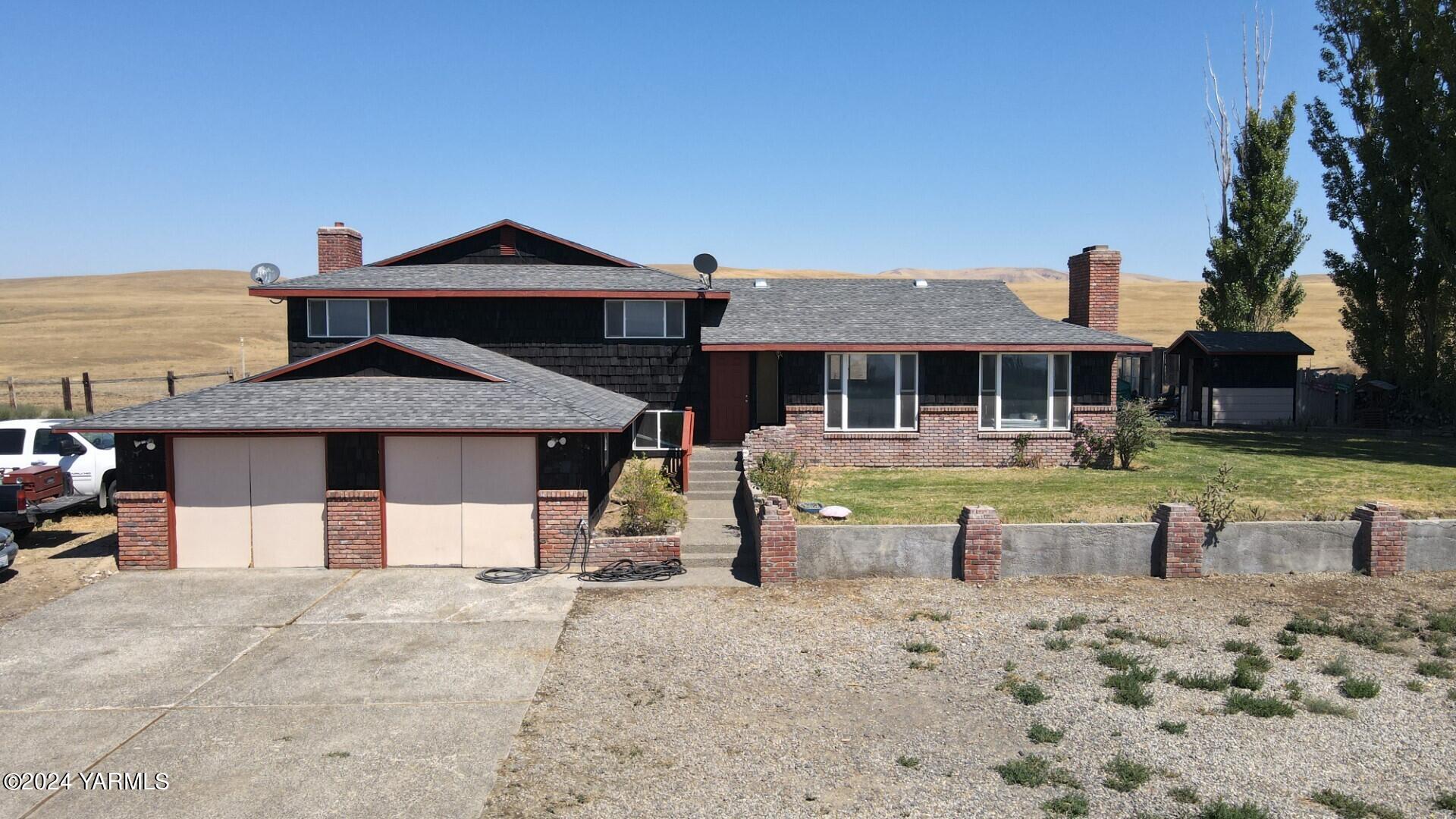 700 Wagoner Road Outlook, WA 98938 - Photo 1 of 29 a front view of a house with swimming pool