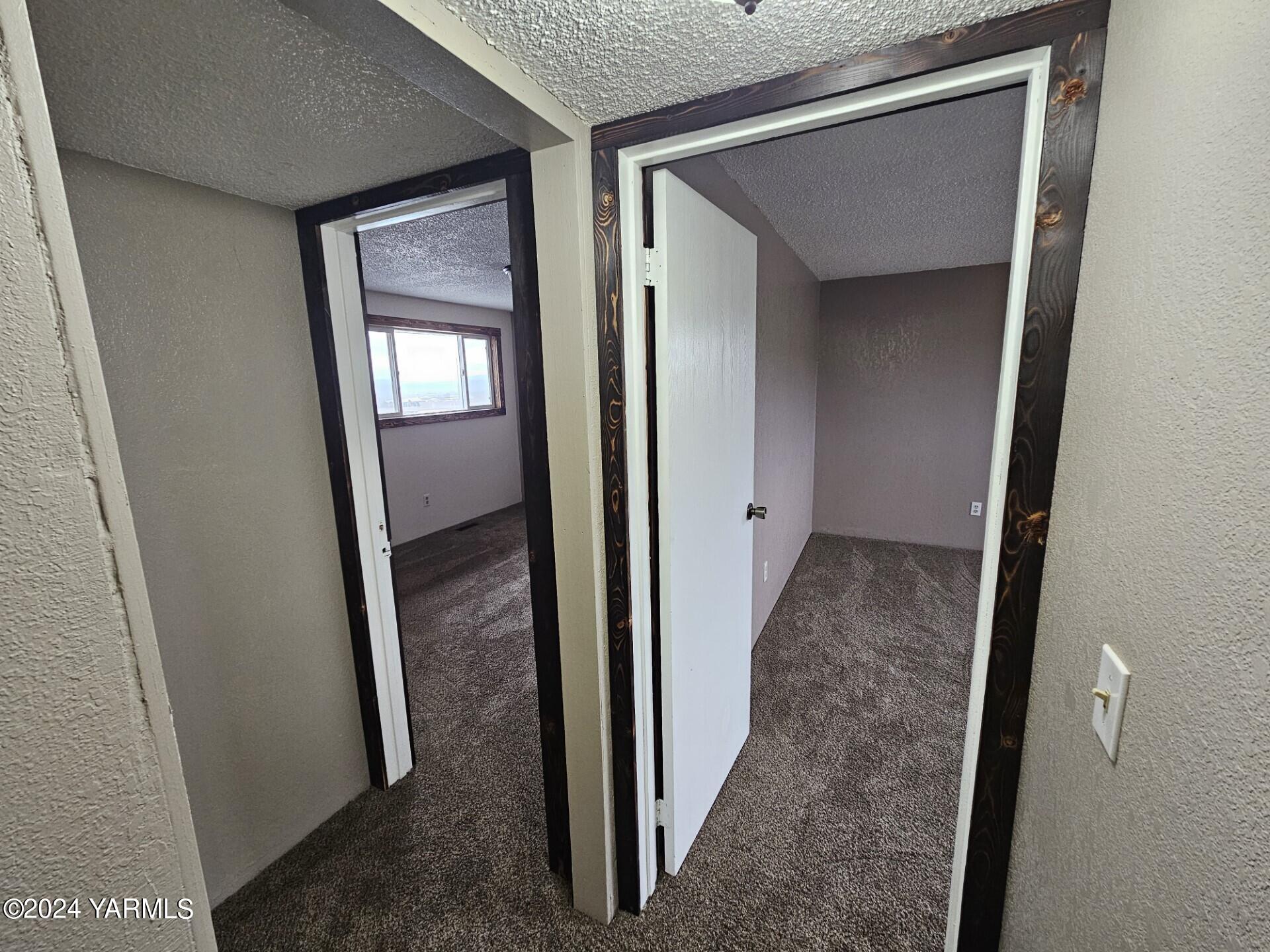 700 Wagoner Road Outlook, WA 98938 - Photo 12 of 29 a view of a hallway with a wooden door