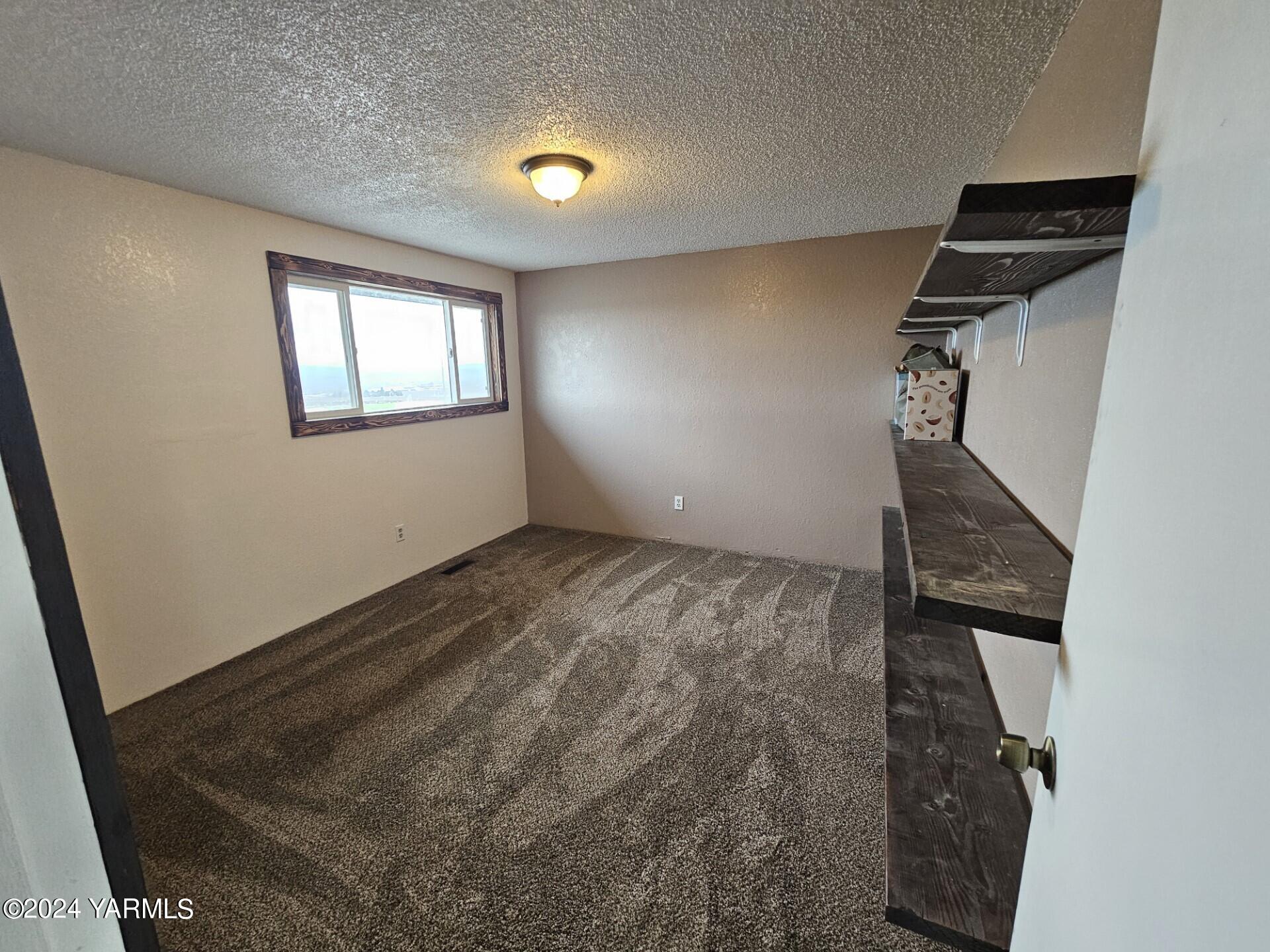 700 Wagoner Road Outlook, WA 98938 - Photo 14 of 29 an empty room with windows