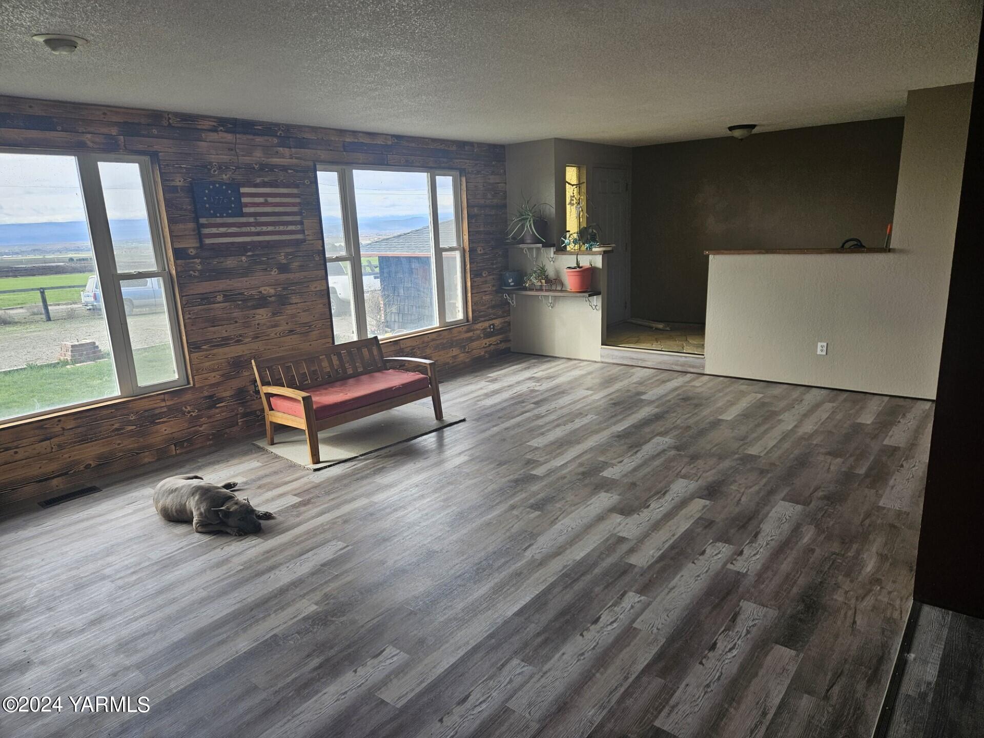 700 Wagoner Road Outlook, WA 98938 - Photo 3 of 29 a living room with furniture and a wooden floor