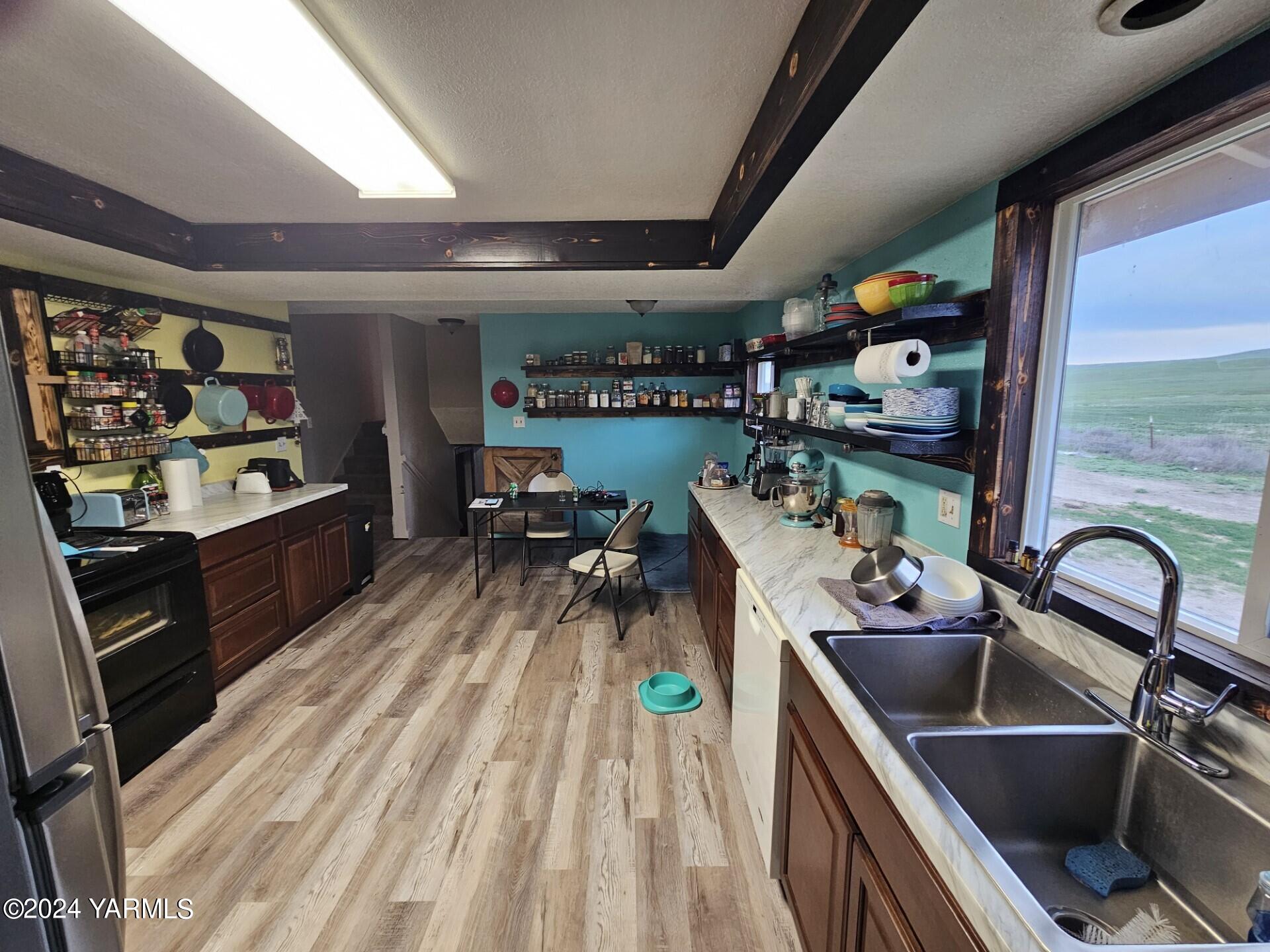 700 Wagoner Road Outlook, WA 98938 - Photo 5 of 29 a room with wooden floor furniture and a window