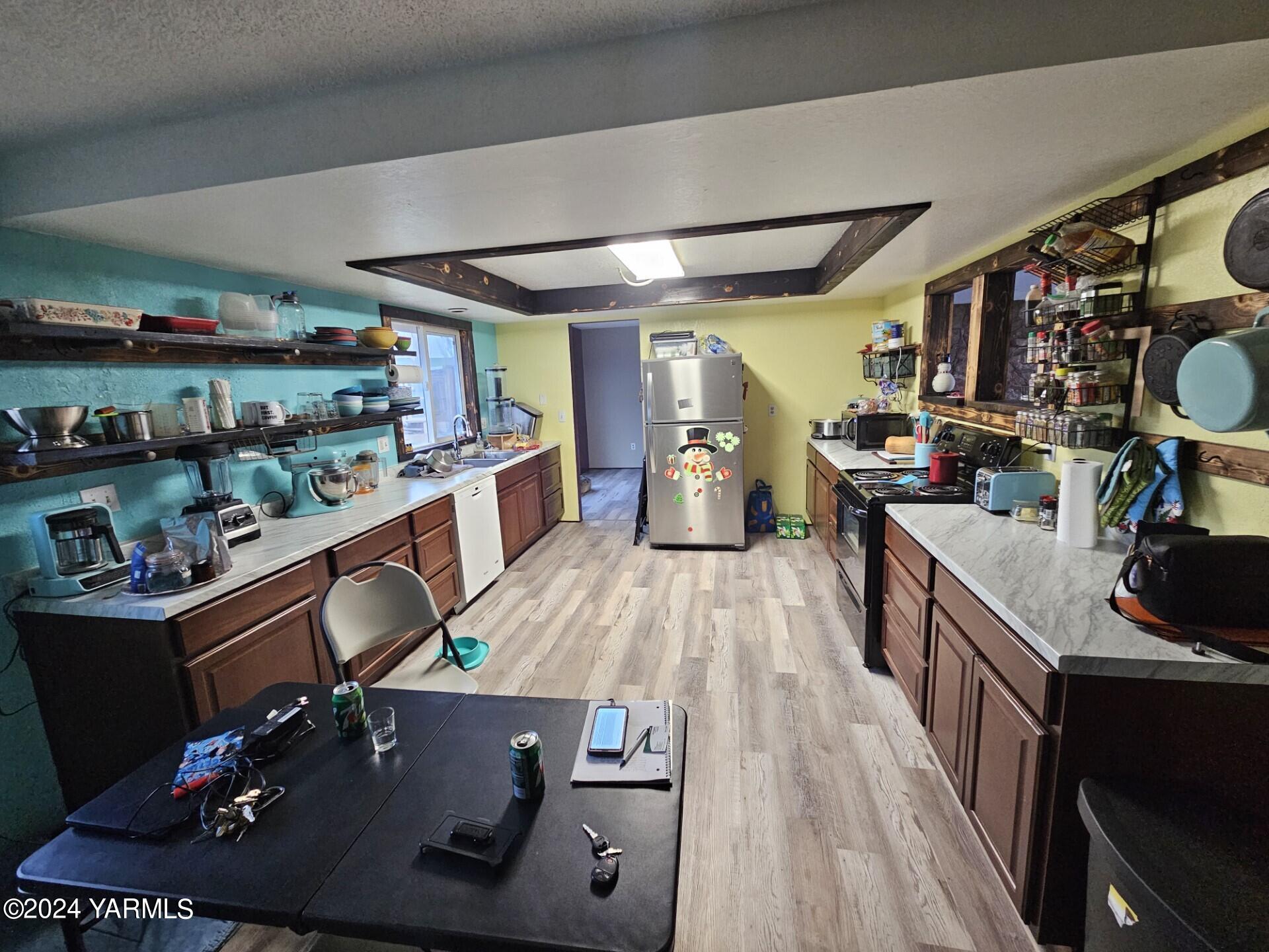 700 Wagoner Road Outlook, WA 98938 - Photo 6 of 29 a kitchen with a sink appliances and cabinets