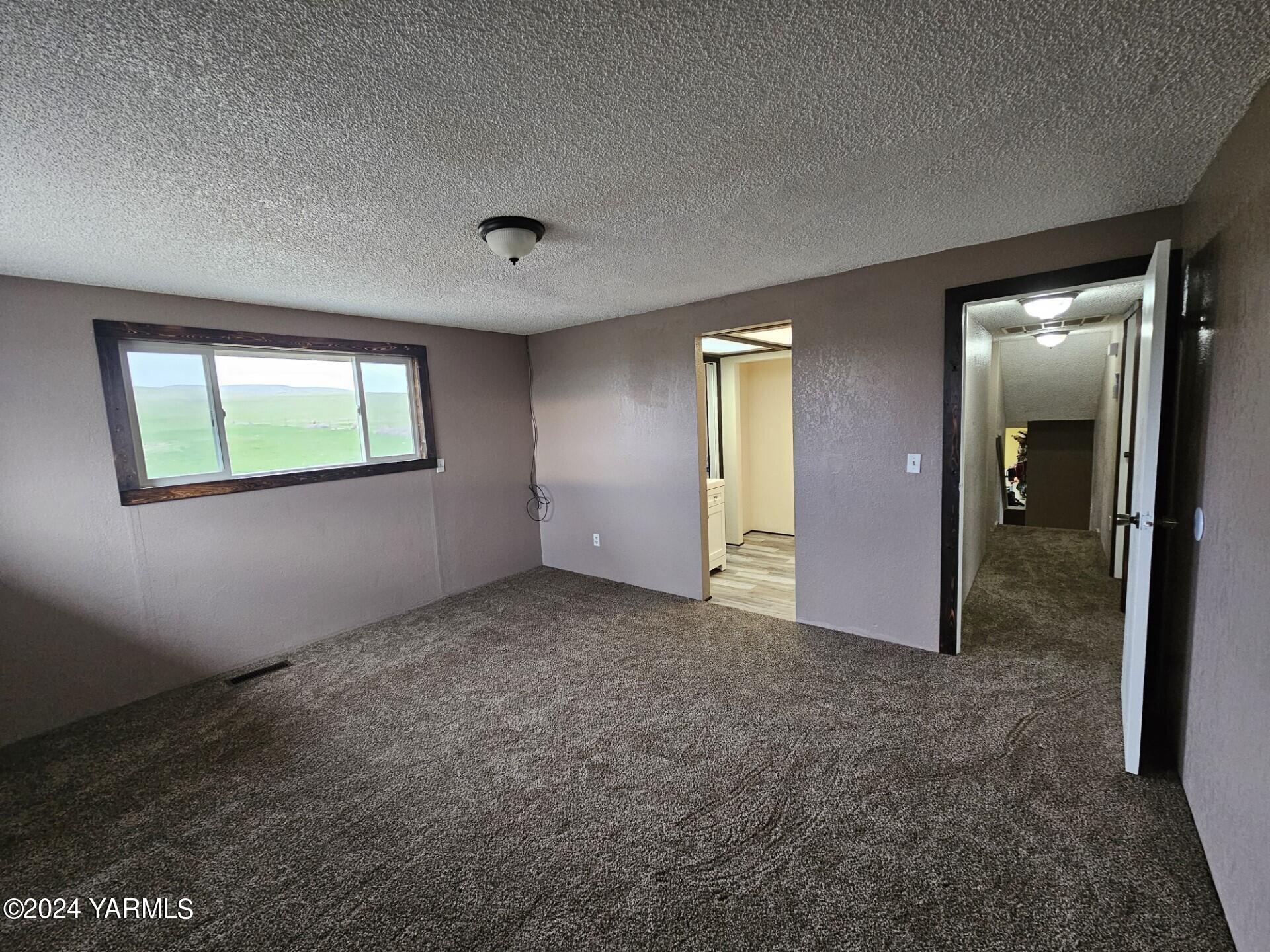 700 Wagoner Road Outlook, WA 98938 - Photo 9 of 29 an empty room with windows and closet